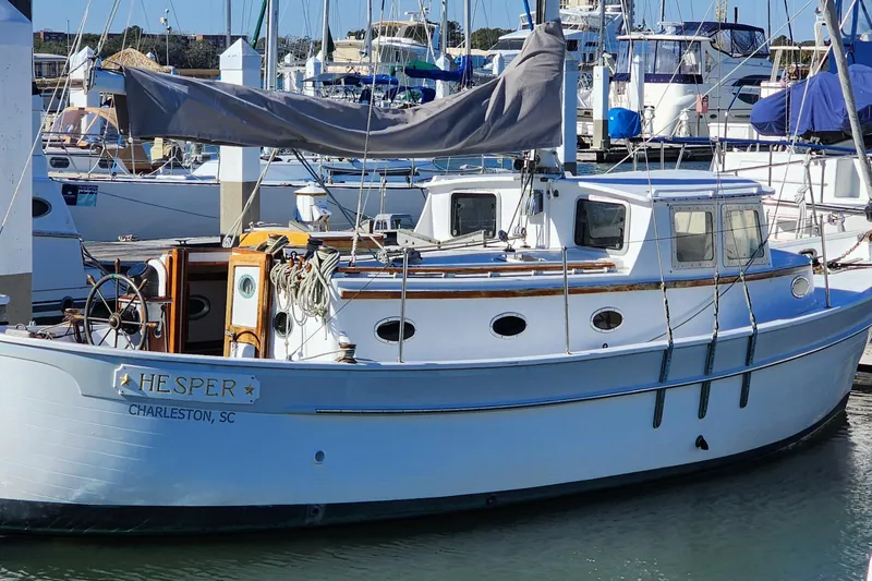 Slide: The Image of 1996 Tillotson-Pearson Motorsailer 32 docked in Charleston marina. - 0