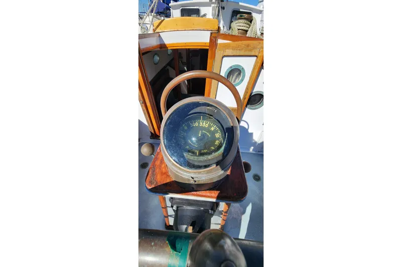 Slide: The Image of Compass on 1996 Tillotson-Pearson Motorsailer 32, wooden details, nautical navigation. - 10
