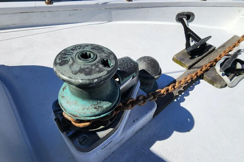 Slide: The Image of Winch and anchor chain on 1996 Tillotson-Pearson Motorsailer 32 deck. - 16