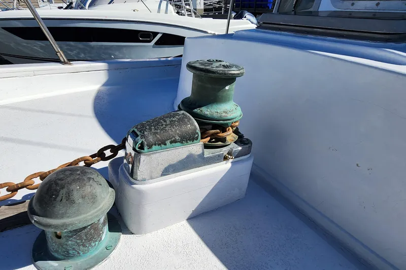 Slide: The Image of Deck of 1996 Tillotson-Pearson Motorsailer 32 with anchor windlass and chain. - 17