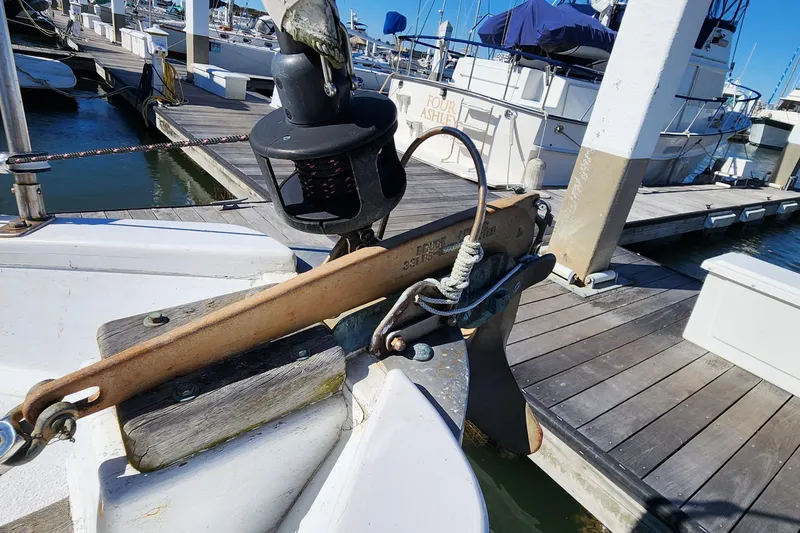 Slide: The Image of 1996 Tillotson-Pearson Motorsailer 32 anchor detail at marina dock. - 20