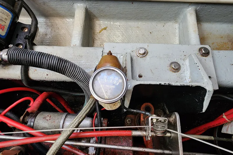 Slide: The Image of Engine compartment of 1996 Tillotson-Pearson Motorsailer 32 with oil pressure gauge. - 66