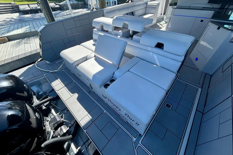 Slide: The Image of 2022 Aviara AV40 OB boat with luxurious seating and dual outboard engines. - 11
