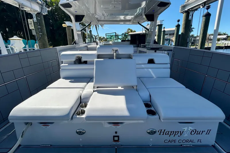 Slide: The Image of 2022 Aviara AV40 OB luxury boat interior with plush seating, docked in Cape Coral, FL. - 12