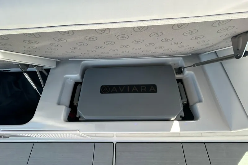 Slide: The Image of 2022 Aviara AV40 OB storage compartment with branded cover, showcasing sleek design and functionality. - 19