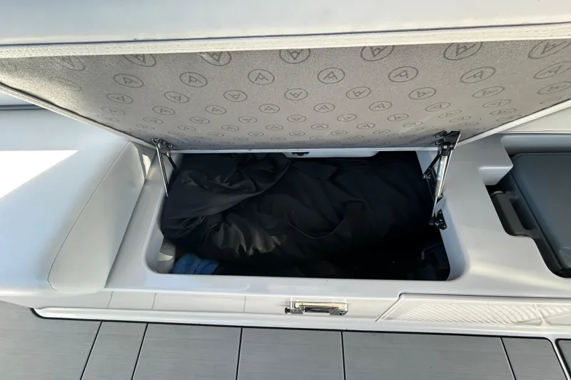 Slide: The Image of Open storage compartment in 2022 Aviara AV40 OB boat. - 20