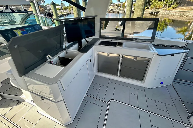 Slide: The Image of Luxurious 2022 Aviara AV40 OB yacht interior with modern kitchen and navigation screens. - 22