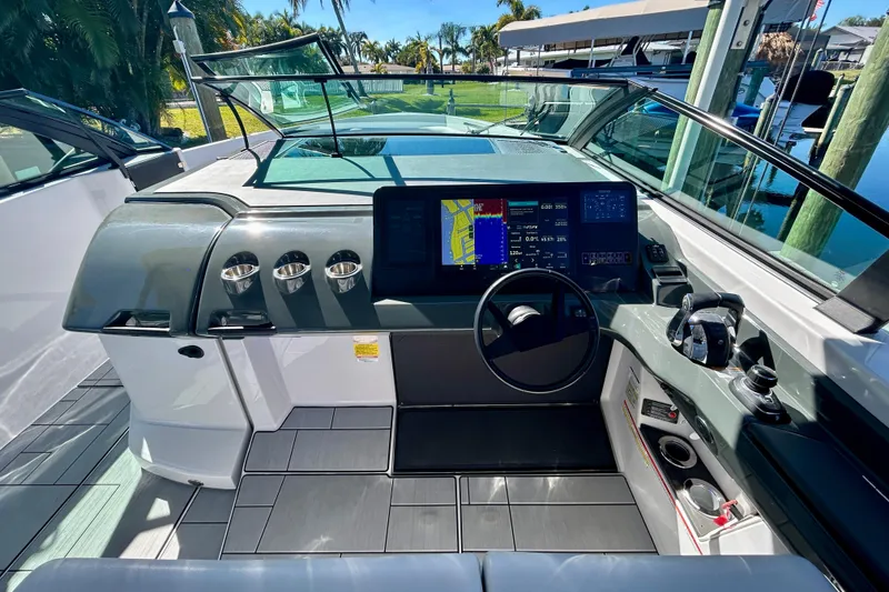 Slide: The Image of 2022 Aviara AV40 OB boat cockpit with modern navigation system and sleek design. - 29