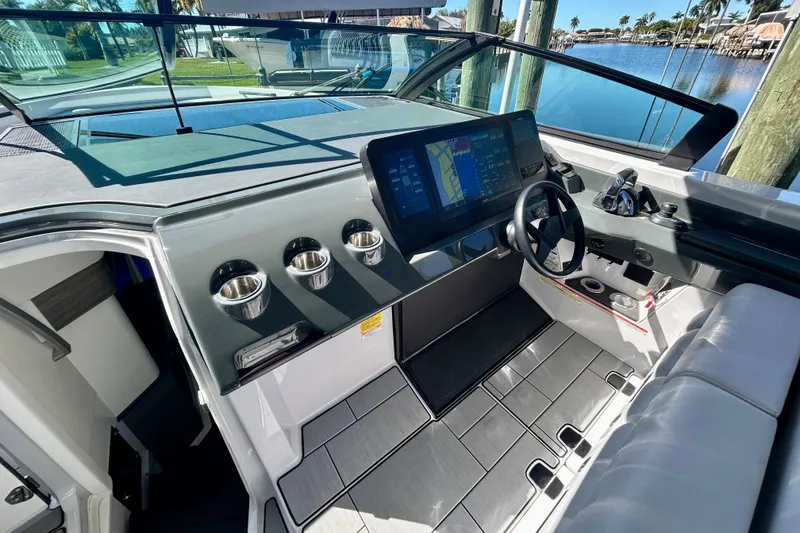 Slide: The Image of 2022 Aviara AV40 OB boat cockpit with modern dashboard and steering wheel. - 30
