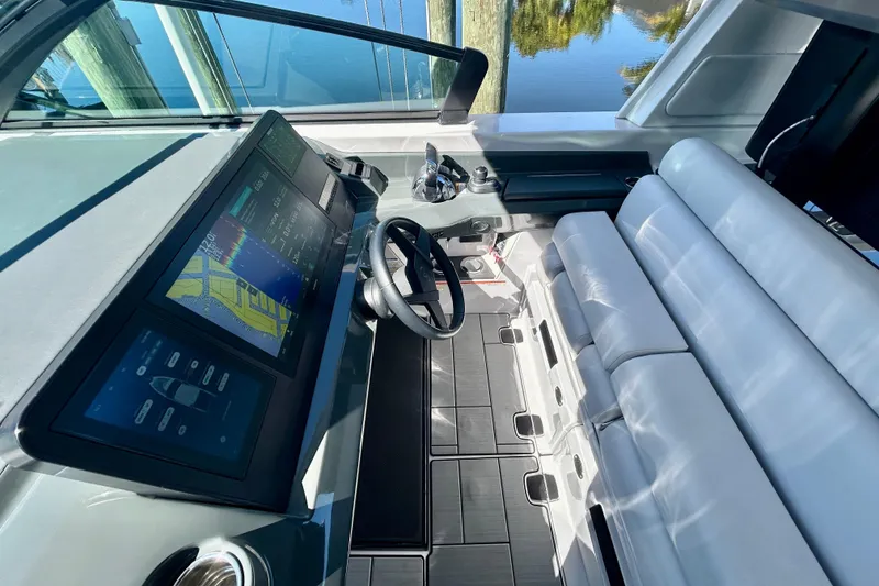 Slide: The Image of 2022 Aviara AV40 OB helm with modern controls and navigation screens. - 31