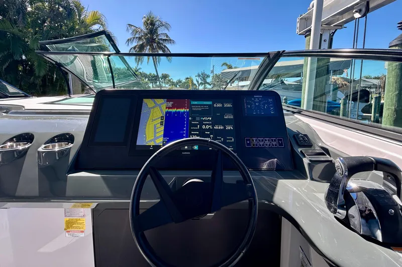 Slide: The Image of Cockpit view of 2022 Aviara AV40 OB boat with advanced navigation system and controls. - 32