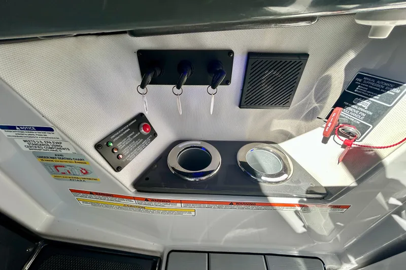 Slide: The Image of Control panel of 2022 Aviara AV40 OB boat with ignition keys and safety features. - 33
