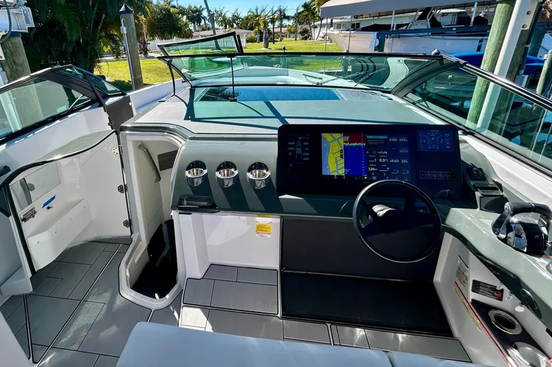Slide: The Image of 2022 Aviara AV40 OB boat cockpit with modern navigation system and sleek design. - 35