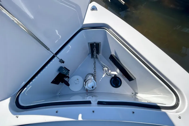 Slide: The Image of 2022 Aviara AV40 OB boat anchor compartment with chain and winch system. - 39