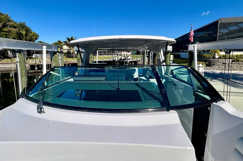 Slide: The Image of 2022 Aviara AV40 OB boat docked, showcasing sleek design and spacious interior. - 42