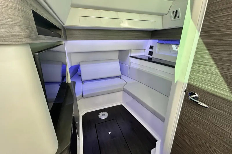 Slide: The Image of 2022 Aviara AV40 OB cabin interior with modern seating and ambient lighting. - 46