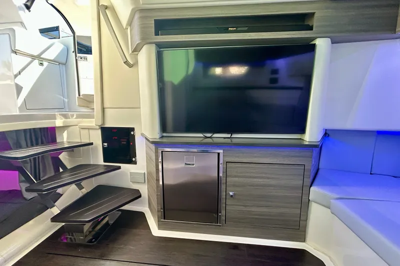 Slide: The Image of Interior of 2022 Aviara AV40 OB boat with modern entertainment system and sleek design. - 50