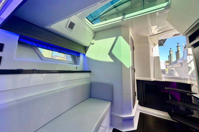 Slide: The Image of Luxurious interior of 2022 Aviara AV40 OB boat with modern seating and ambient lighting. - 52