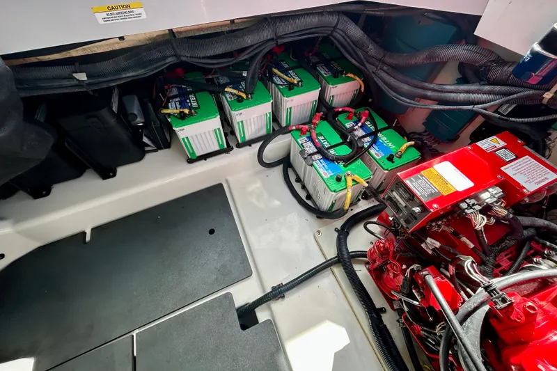 Slide: The Image of 2022 Aviara AV40 OB engine compartment with batteries and wiring. - 59