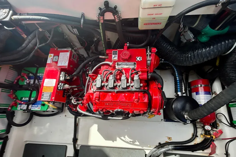 Slide: The Image of Engine compartment of 2022 Aviara AV40 OB with Westerbeke generator and wiring. - 60