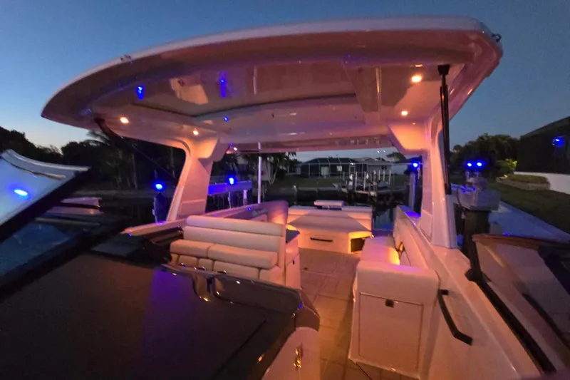 Slide: The Image of Luxurious 2022 Aviara AV40 OB boat interior with ambient lighting at dusk. - 65