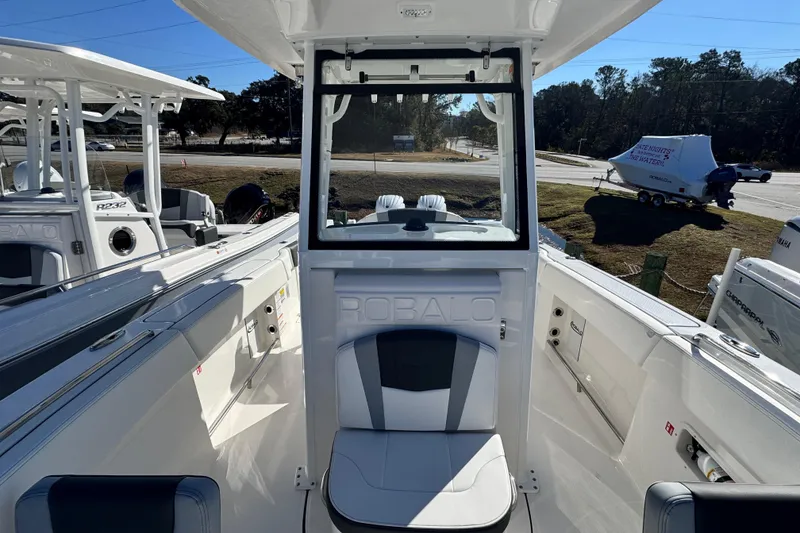 Slide: The Image of 2026 Robalo R250 Center Console boat interior with seating and console view. - 11