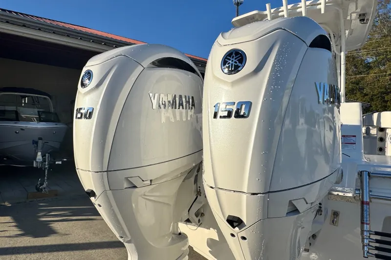 Slide: The Image of Twin Yamaha 150 engines on a 2026 Robalo R250 Center Console boat. - 3
