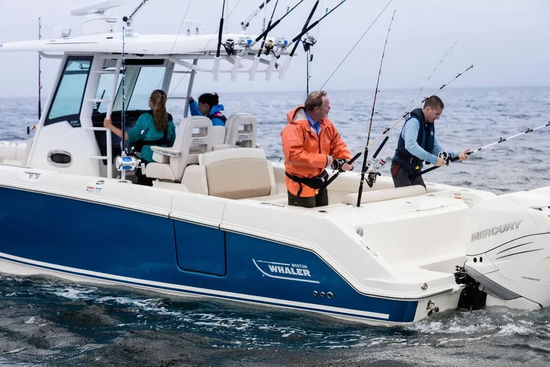 Slide: The Image of Manufacturer Provided Image: 2025 Boston Whaler 330 Outrage with people fishing on open water. - 9