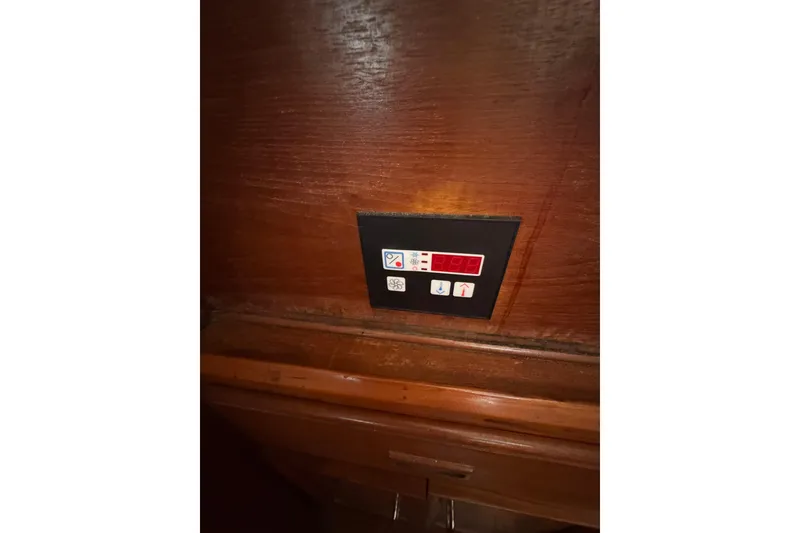 Slide: The Image of Control panel on a 1986 Newburyport 37 boat, mounted on wooden interior. - 25