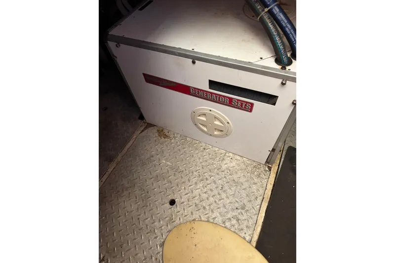 Slide: The Image of Engine room of 1986 Newburyport 37 with generator set. - 27