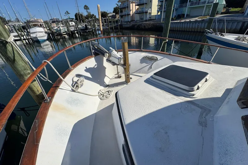 Slide: The Image of Bow of 1986 Newburyport 37 yacht docked at marina with clear sky. - 8