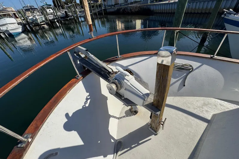 Slide: The Image of Bow of 1986 Newburyport 37 boat with anchor and marina view. - 9