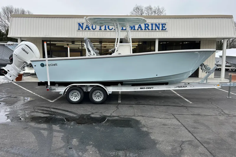The Image of 2026 May-Craft 245 Offshore CC boat on trailer outside Nautical Marine store. - 0