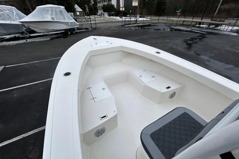 Slide: The Image of 2026 May-Craft 245 Offshore CC boat interior with seating and storage compartments. - 12