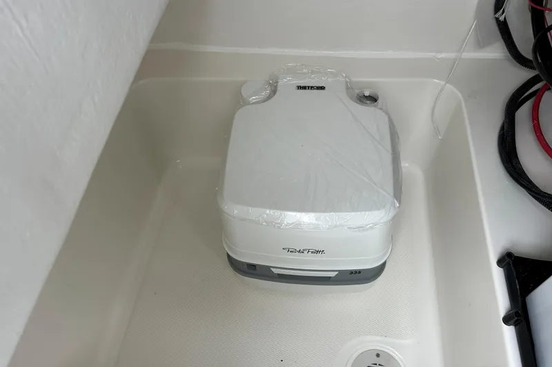 Slide: The Image of Portable toilet in 2026 May-Craft 245 Offshore CC boat interior. - 15