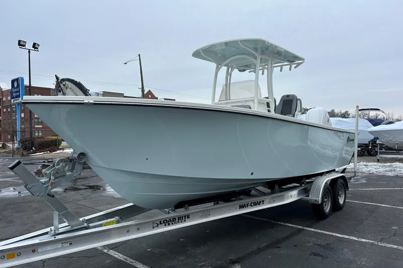 Slide: The Image of 2026 May-Craft 245 Offshore CC boat on trailer in parking lot. - 20