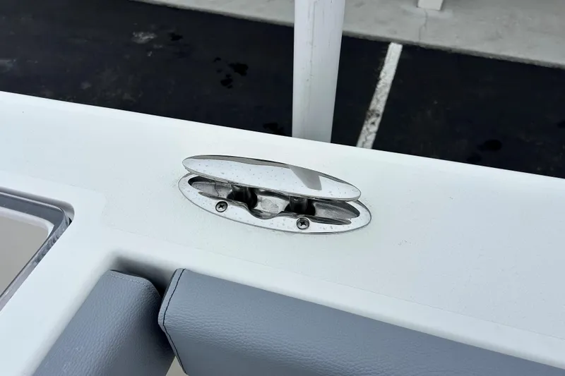 Slide: The Image of 2026 May-Craft 245 Offshore CC boat cleat on white deck surface. - 24