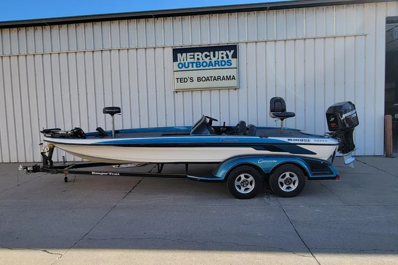 The Image of 2000 Ranger 522DVX Comanche boat on trailer at Ted's Boatarama, Mercury outboard. - 0