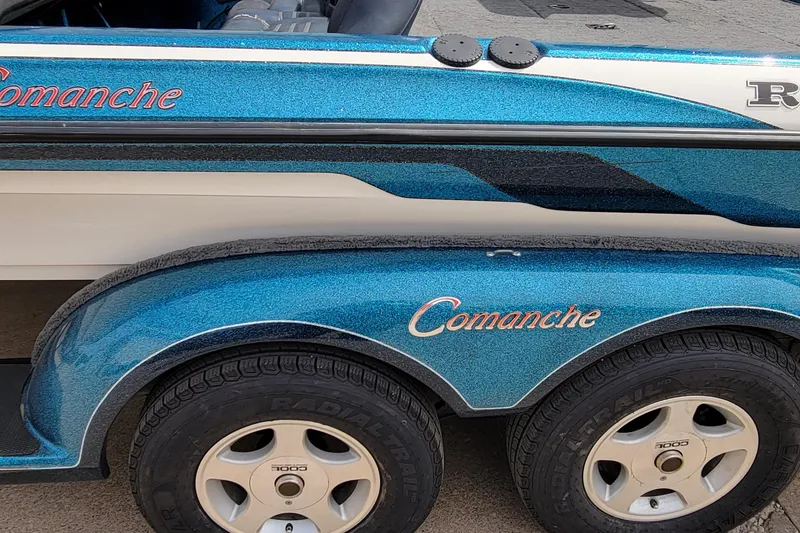 Slide: The Image of 2000 Ranger 522DVX Comanche boat trailer with blue metallic finish and branded lettering. - 14