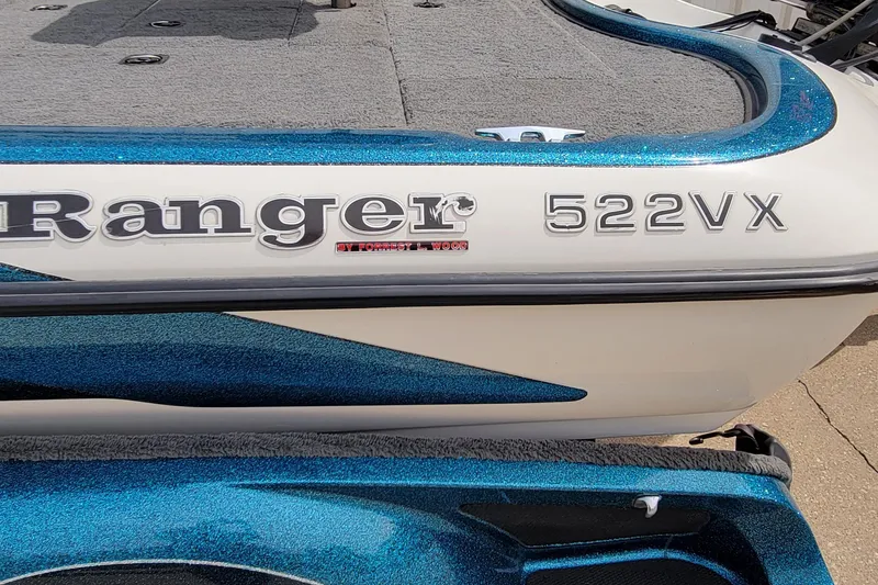 Slide: The Image of 2000 Ranger 522DVX Comanche boat with blue and white detailing. - 15
