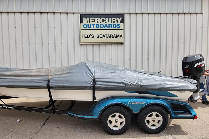 Slide: The Image of 2000 Ranger 522DVX Comanche boat with cover at Ted's Boatarama, Mercury outboard engine. - 7