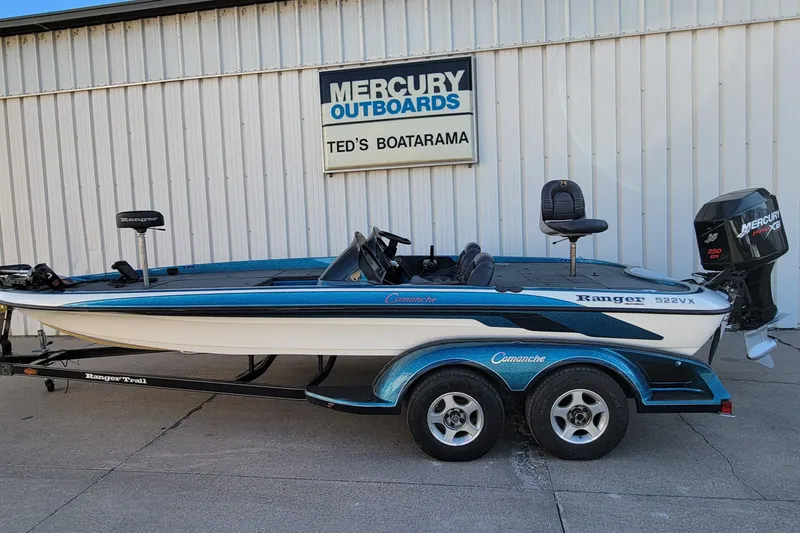 Slide: The Image of 2000 Ranger 522DVX Comanche boat at Ted's Boatarama, featuring Mercury outboard. - 9