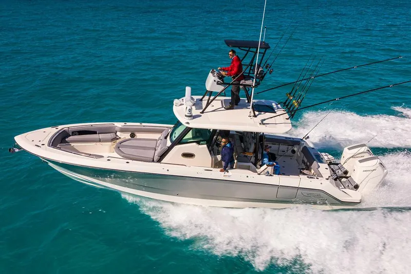 The Image of Manufacturer Provided Image: 2026 Boston Whaler 360 Outrage cruising on clear blue water. - 0