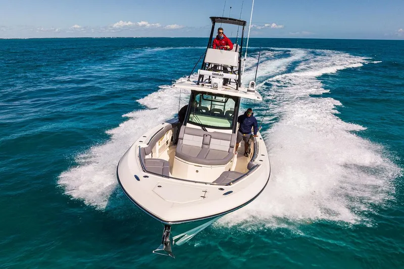Slide: The Image of Manufacturer Provided Image: 2026 Boston Whaler 360 Outrage cruising on clear blue ocean waters. - 2