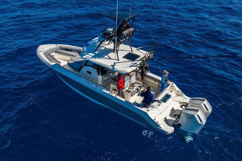 Slide: The Image of Manufacturer Provided Image: 2026 Boston Whaler 360 Outrage boat on open ocean with people fishing. - 8