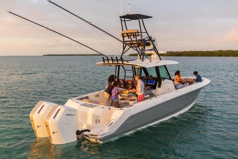 Slide: The Image of Manufacturer Provided Image: 2026 Boston Whaler 360 Outrage boat with people enjoying a day on the water. - 9