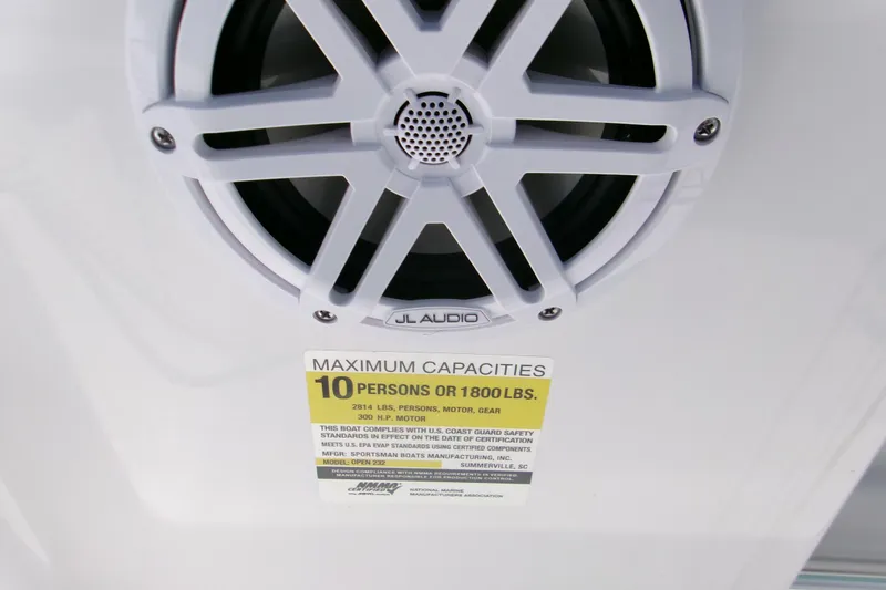 Slide: The Image of JL Audio speaker and capacity label on 2026 Sportsman Open 232 Center Console boat. - 10