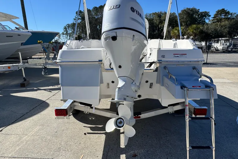 Slide: The Image of 2026 Robalo R160 Center Console boat with Yamaha outboard motor, rear view. - 6