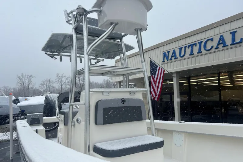 Slide: The Image of 2026 May-Craft 238 Offshore CC boat in snowy weather outside Nautical store. - 10