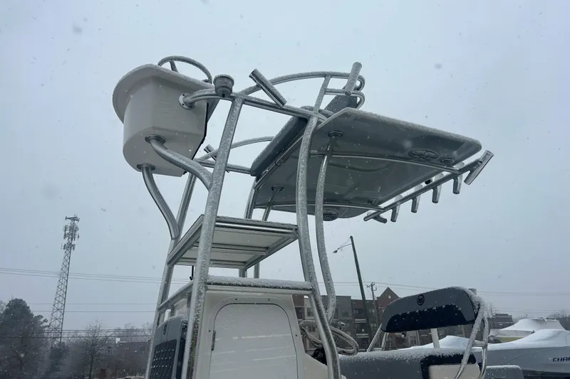 Slide: The Image of 2026 May-Craft 238 Offshore CC boat in snowy weather, showcasing upper deck and equipment. - 11